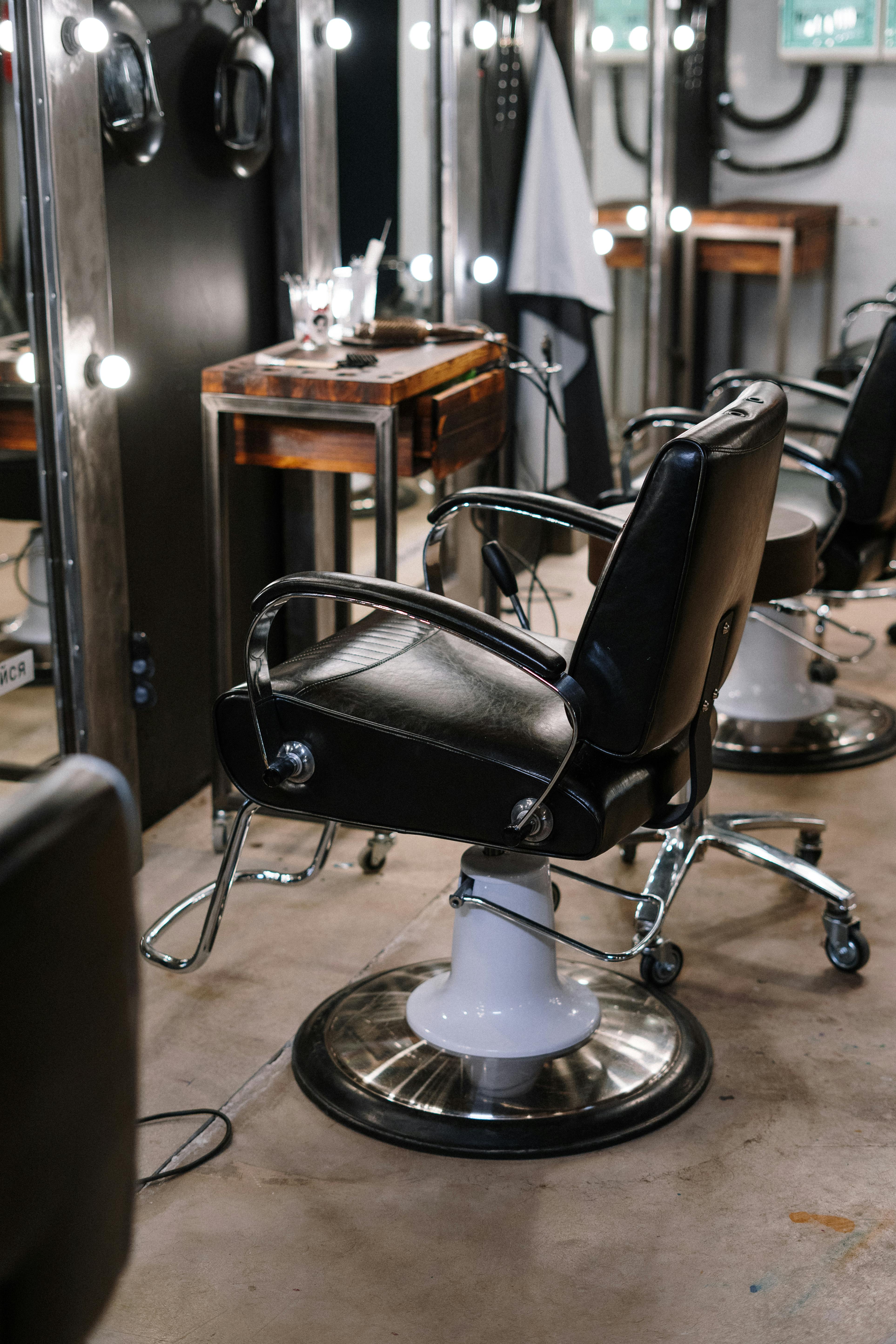 Classic leather barber chair in a well-equipped barbershop ready for the next client